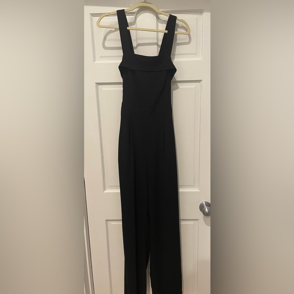 Adelyn Rae black jumpsuit that ties in back